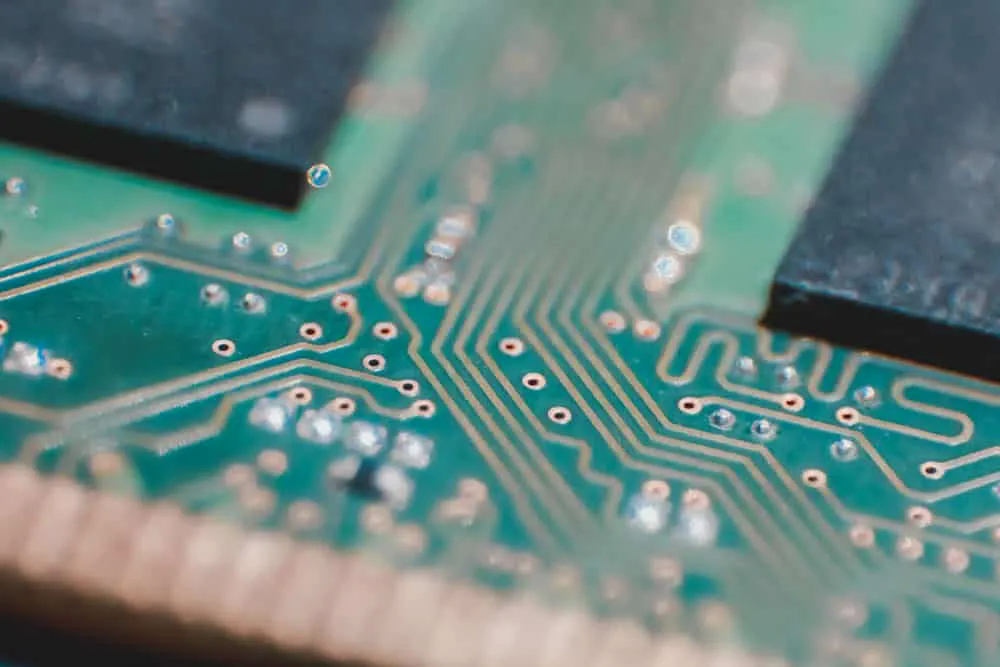 Green FR-4 board closeup showing copper and soldermask